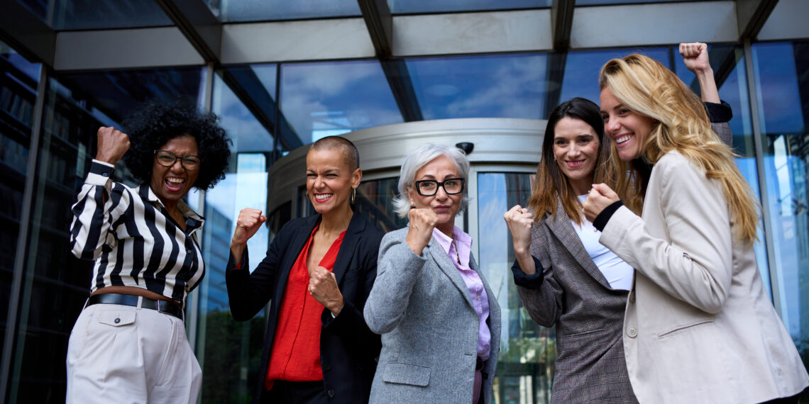 A group of happy business women at a female-focused startup